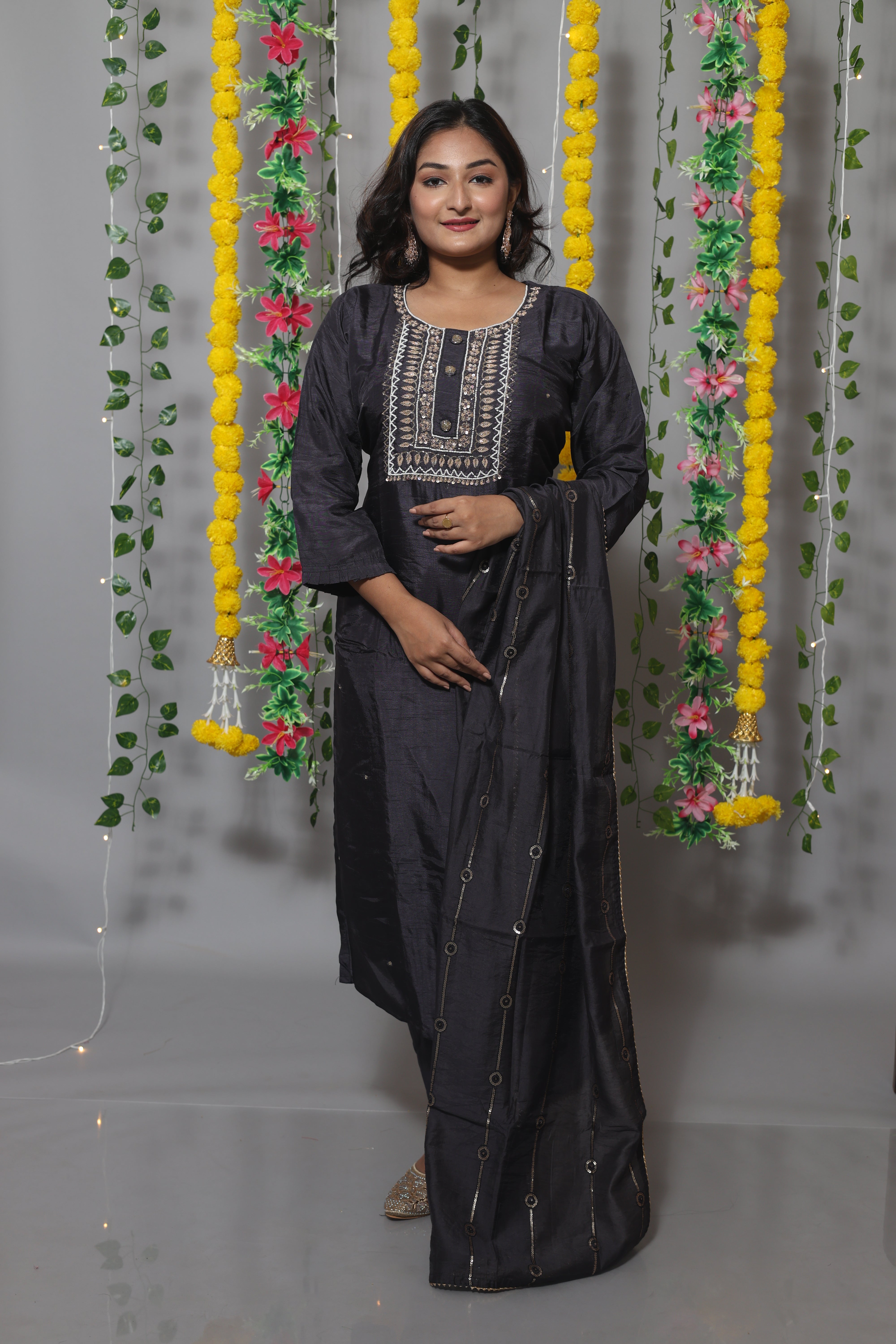 Black dola silk suit set featuring exquisite handwork