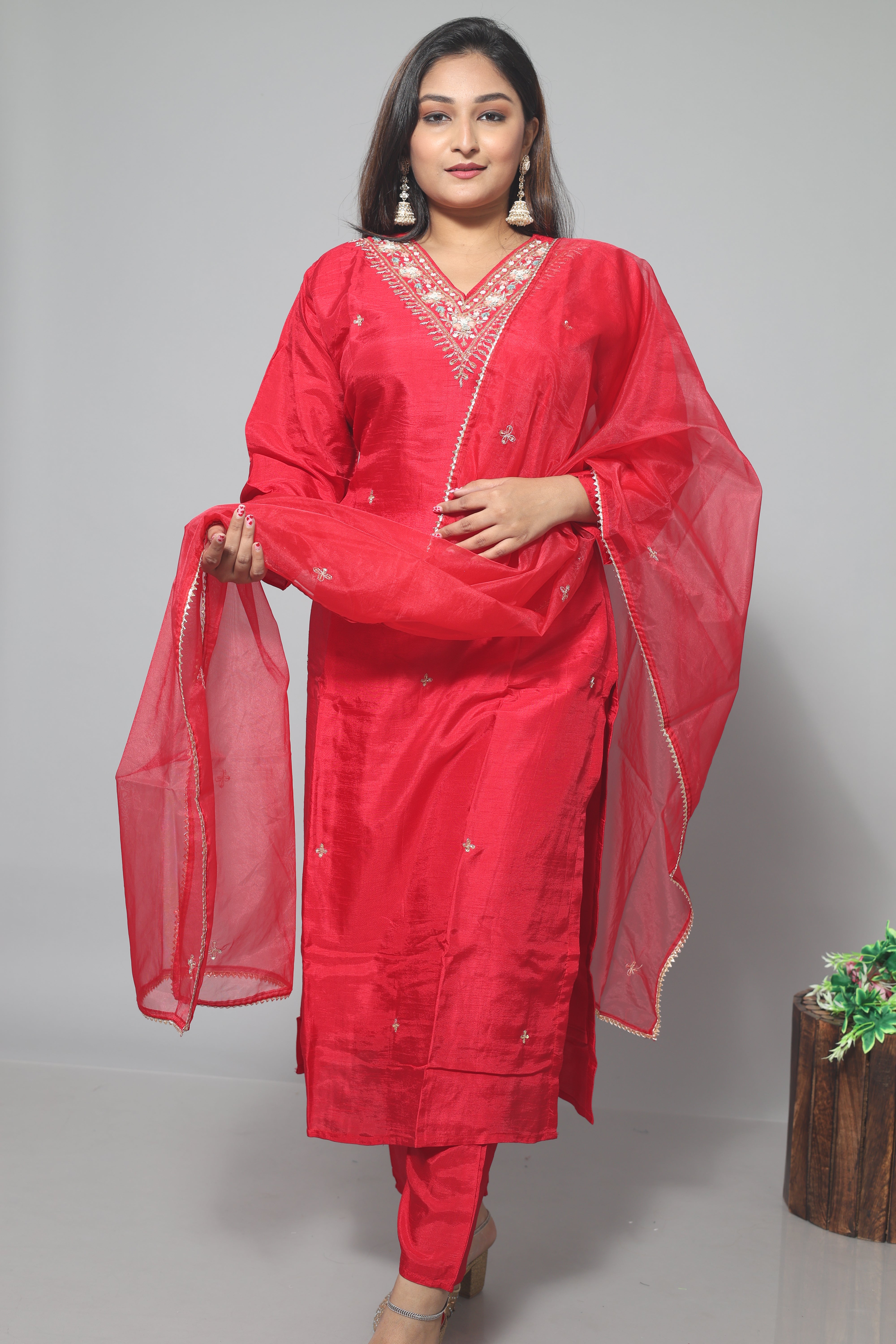 Red dola silk suit set featuring beautiful handwork