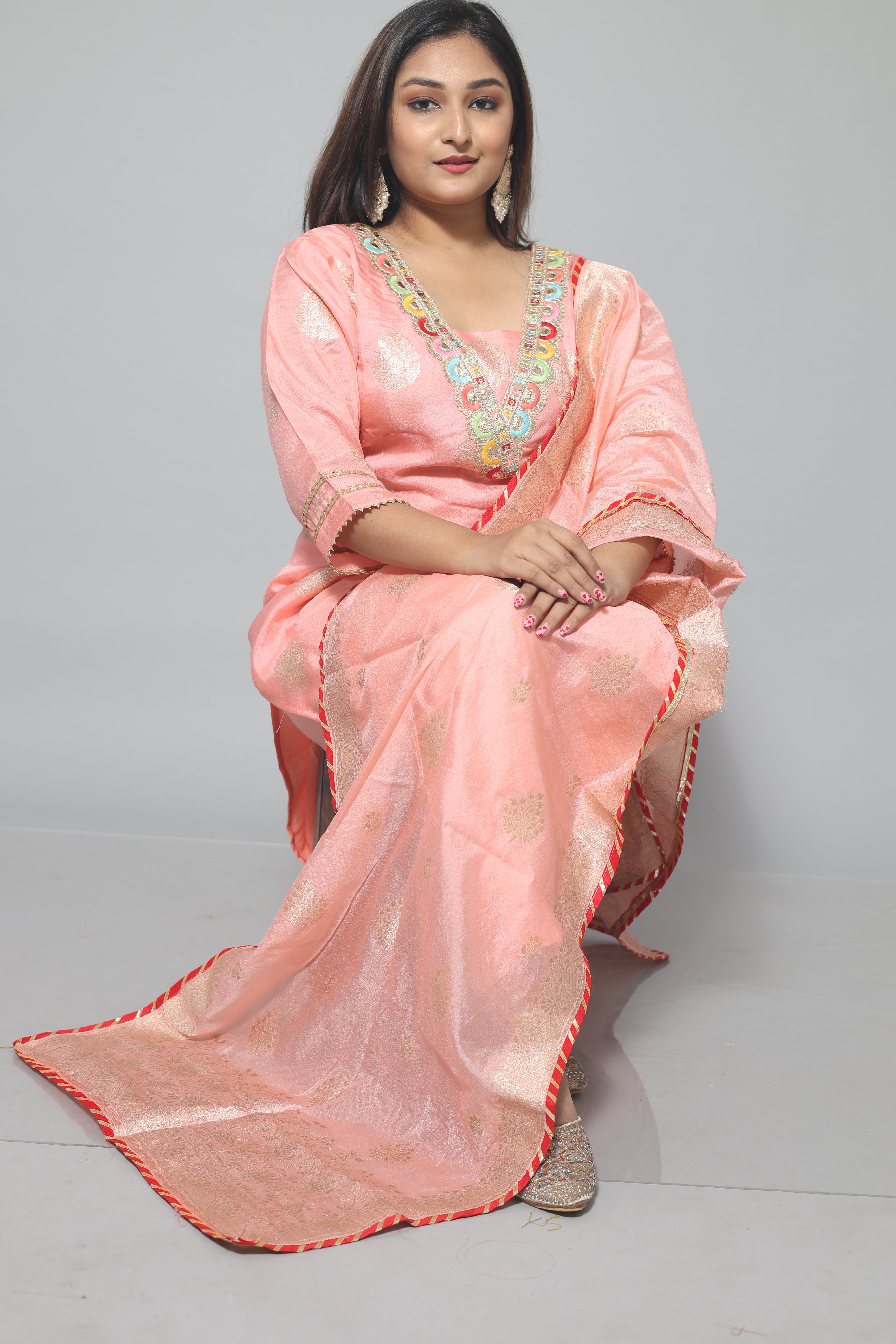 Peach color dola silk suit set with intricate hand embroidery