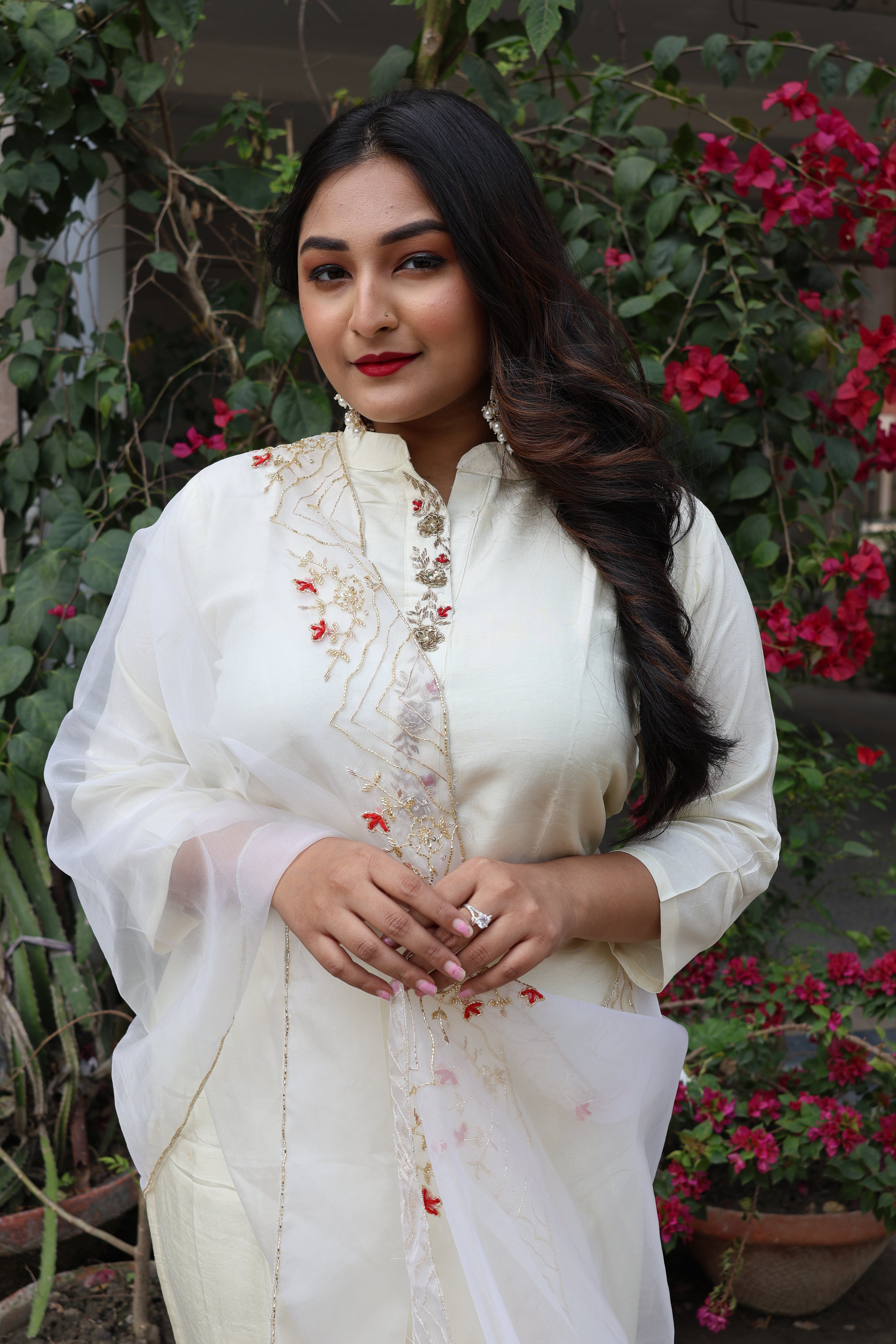 Off white dola silk suit set featuring intricate handwork