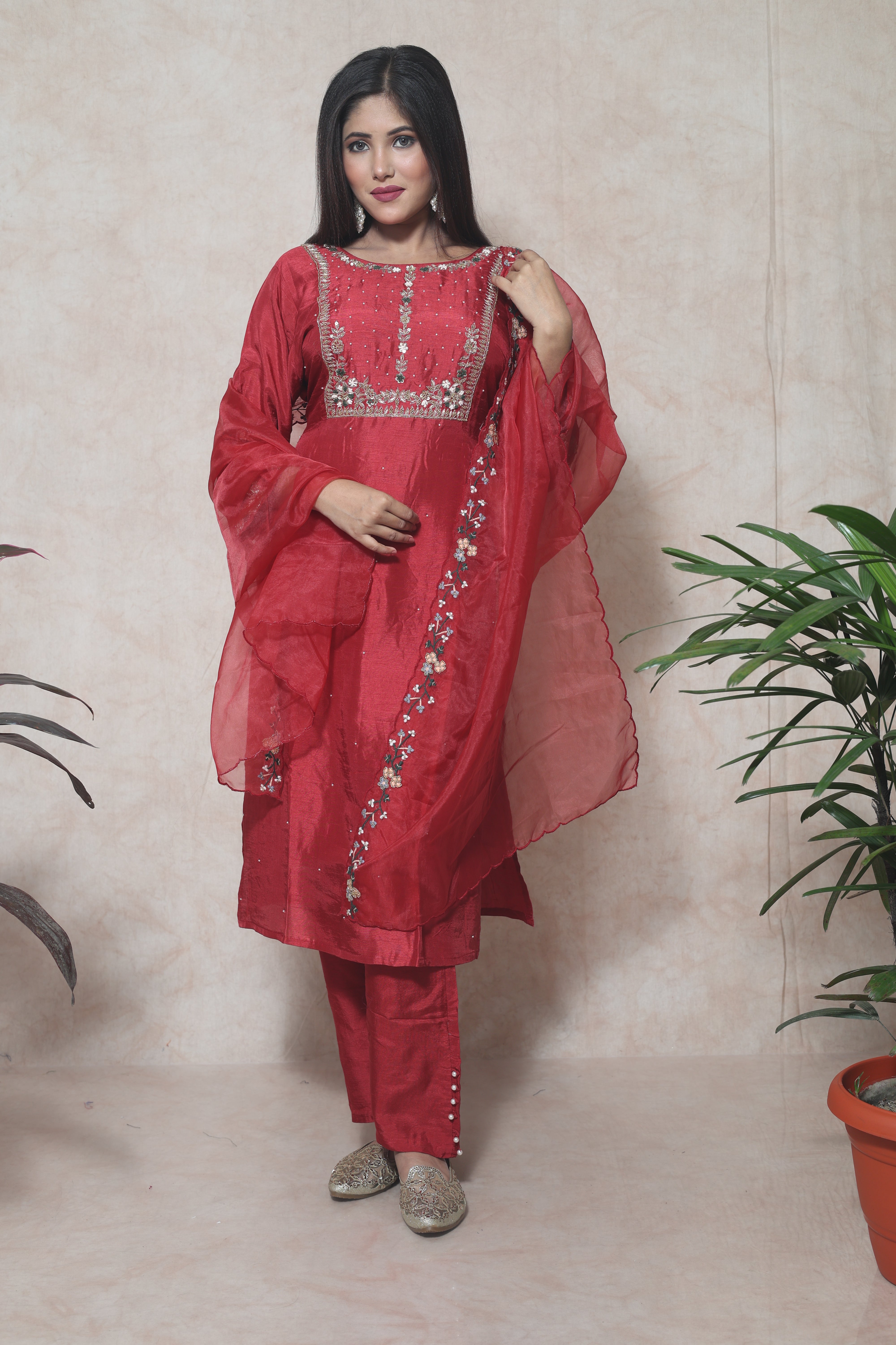 Red color dola silk suit set featuring exquisite handwork