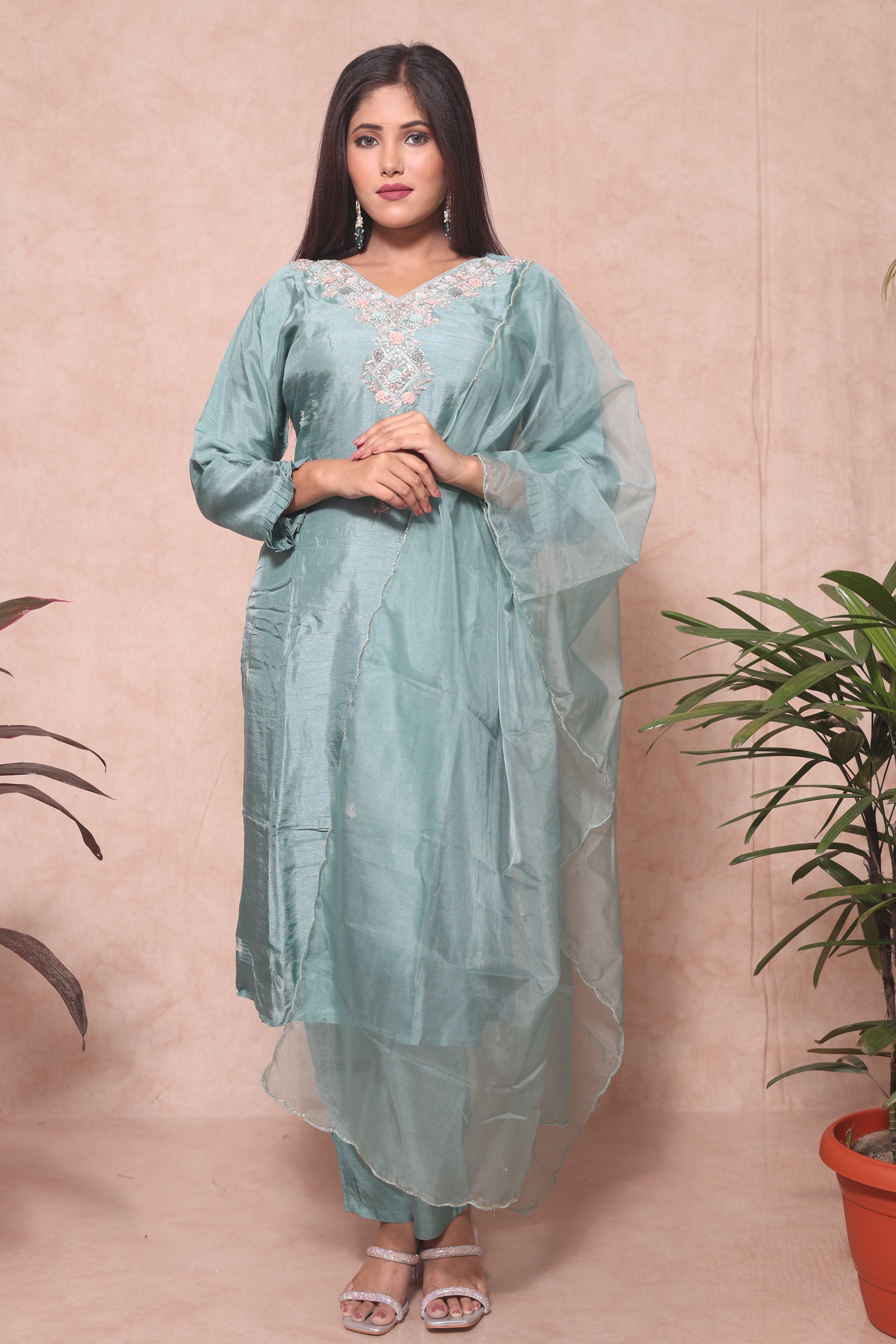 Pastel green color dola silk suit set featuring beautiful handwork
