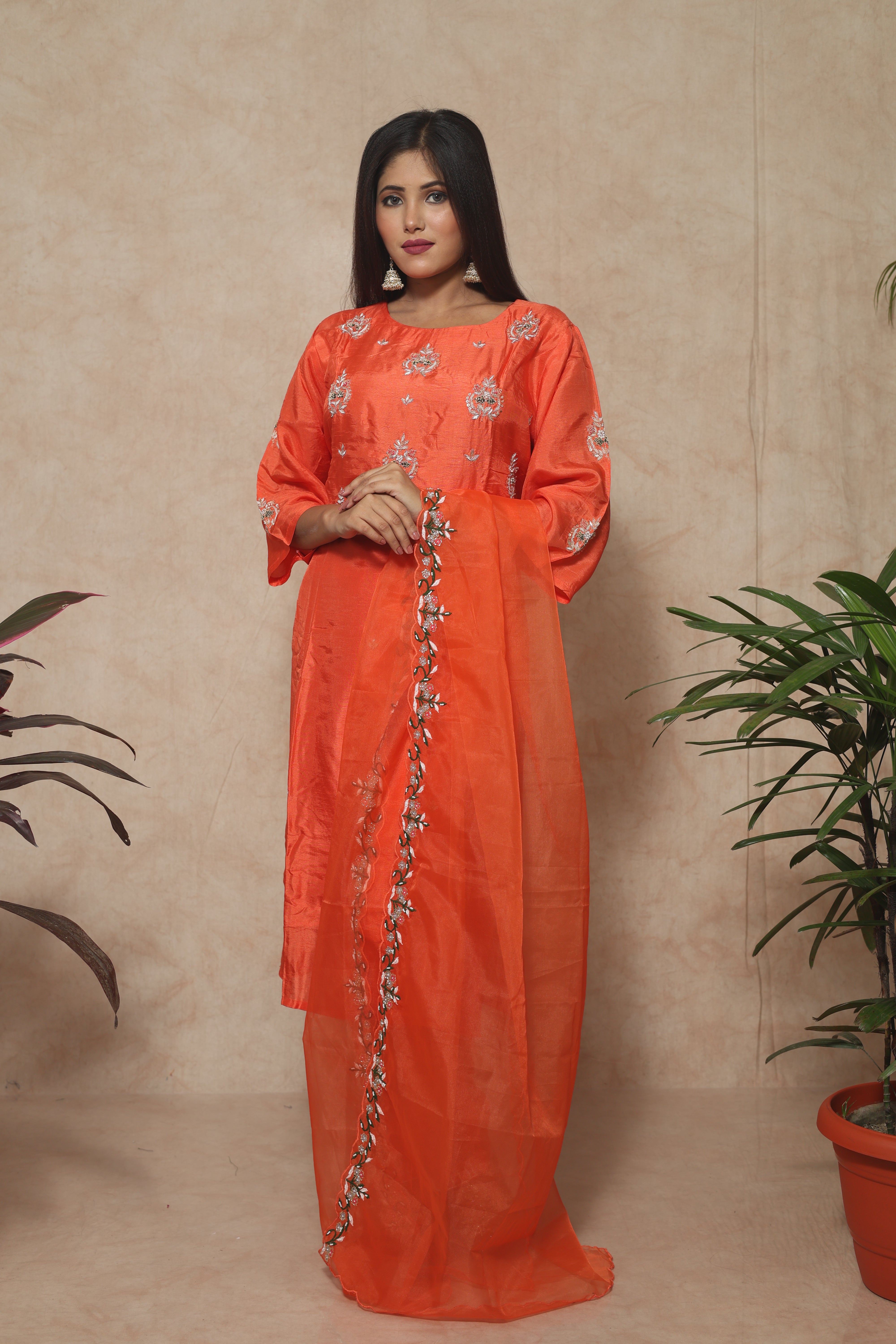 Saffron color dola silk suit set featuring beautiful handwork
