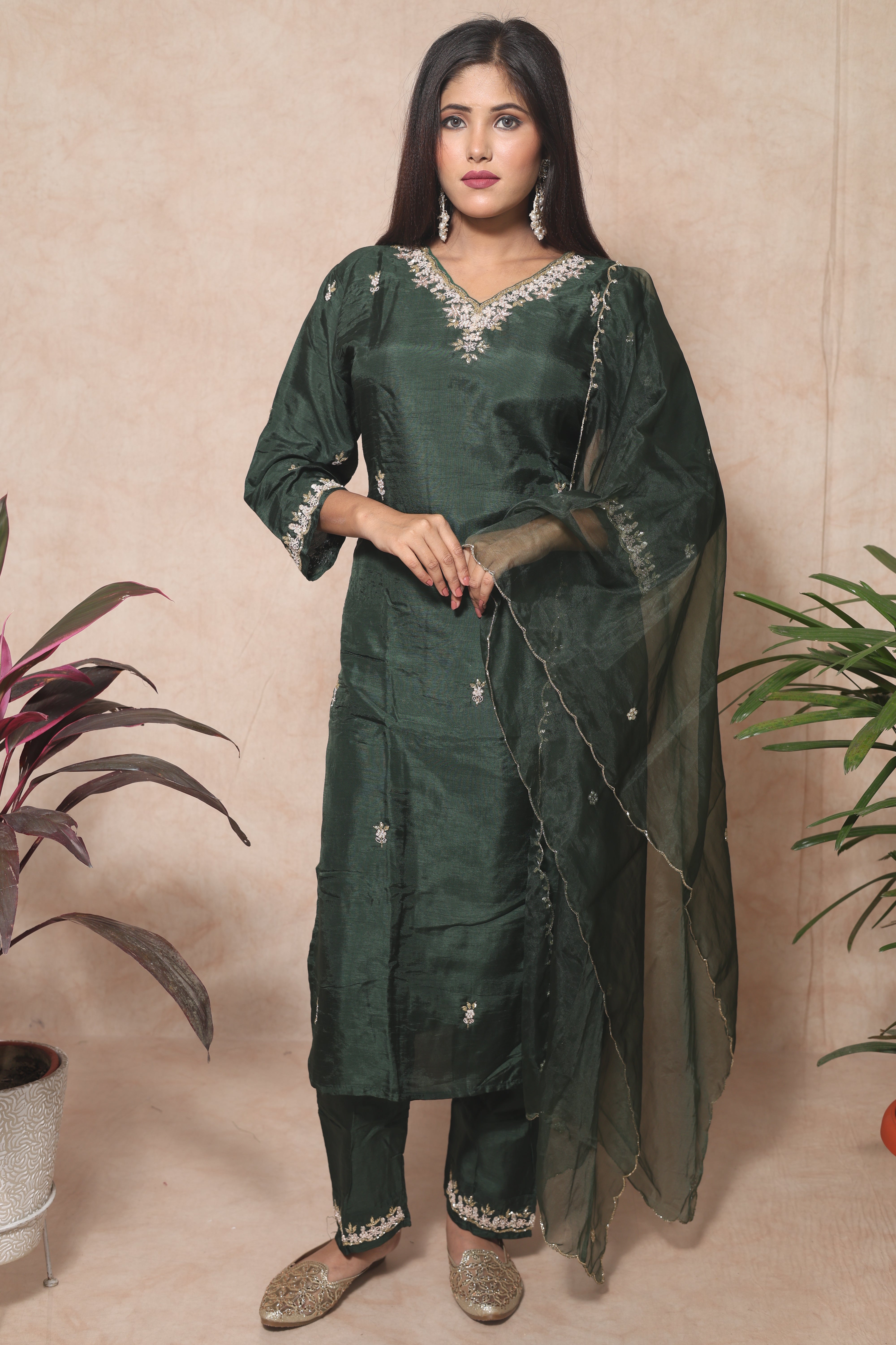 Green dola silk suit set featuring exquisite handwork