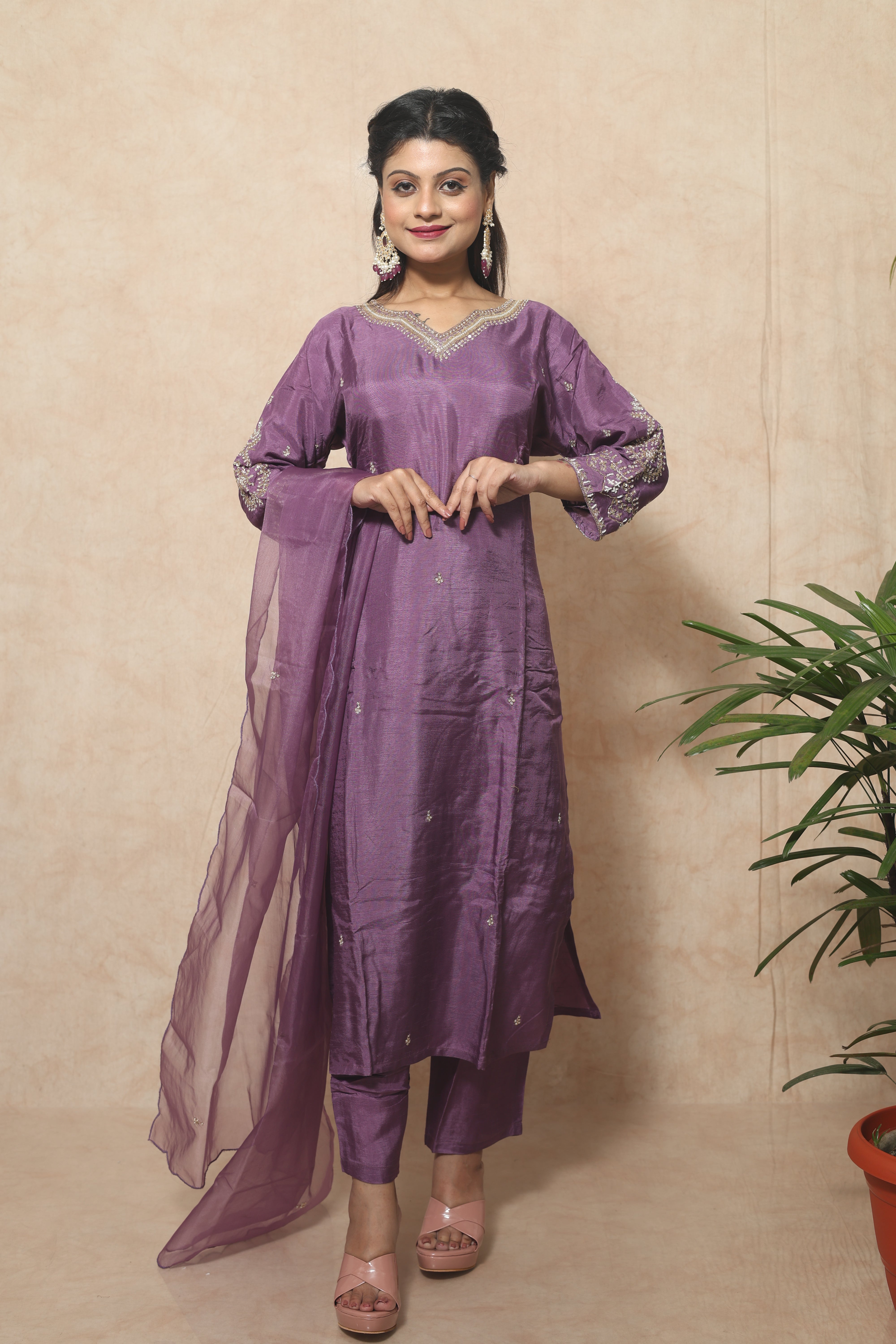 Purple color dola silk suit set featuring exquisite handwork