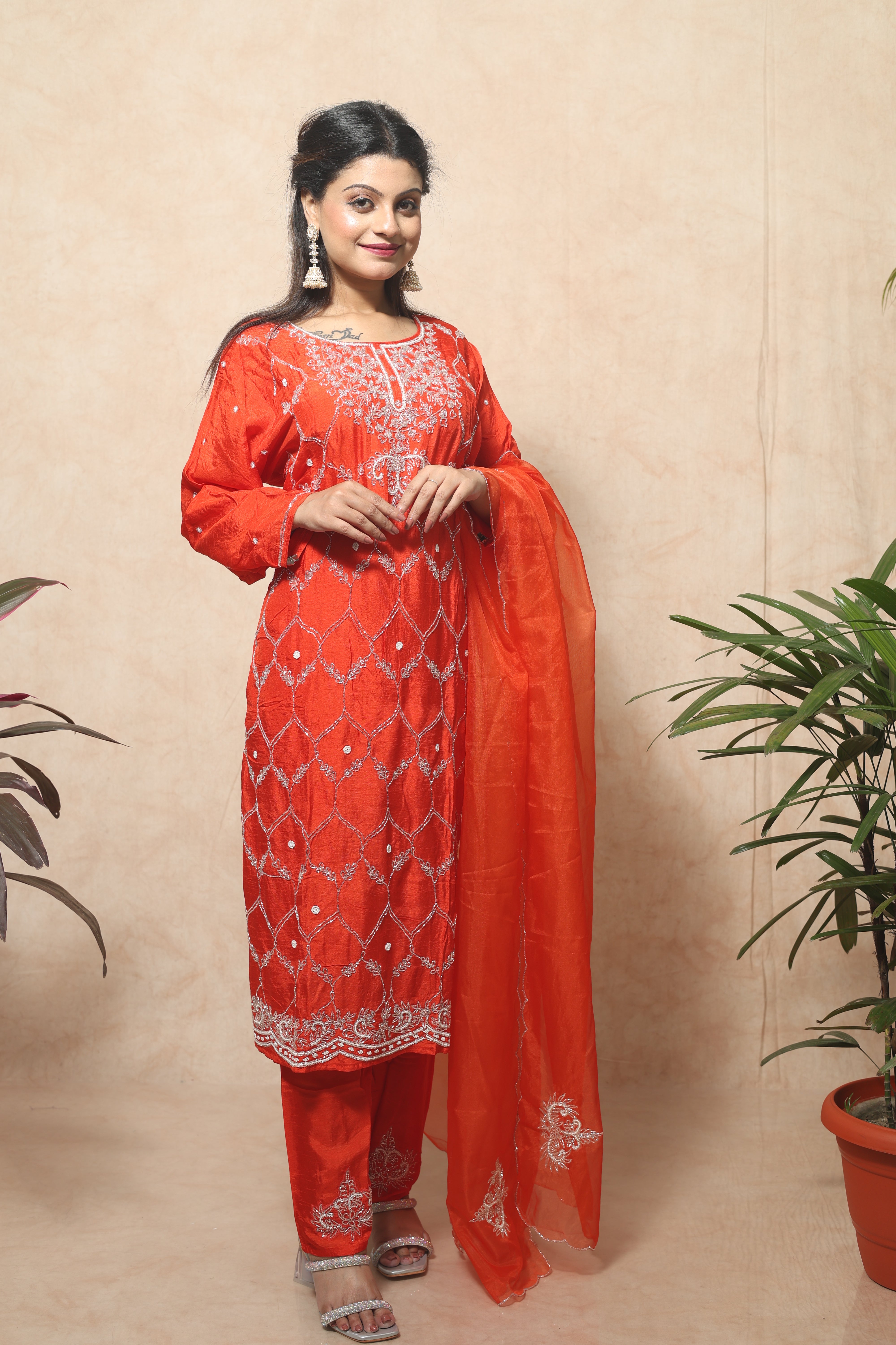 Saffron color dola silk suit set featuring exquisite handwork