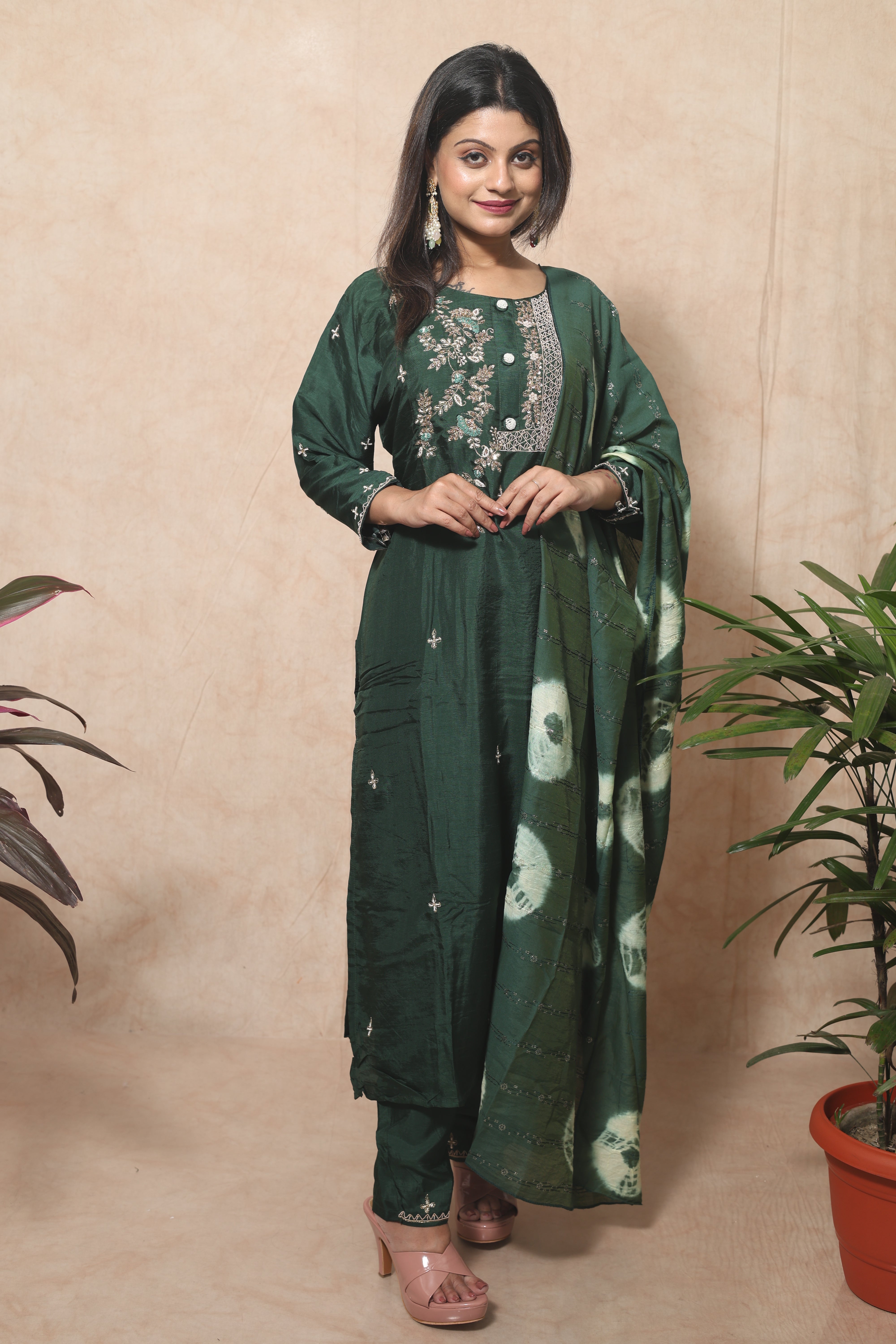 Green dola silk suit set featuring beautiful hand embroidery